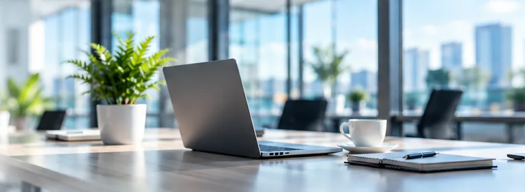 Bright modern office with laptop